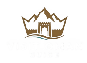 Logo for Visit Oman Guide featuring a stylized brown mountain range forming a crown shape above an ancient Omani fort and turquoise waves.